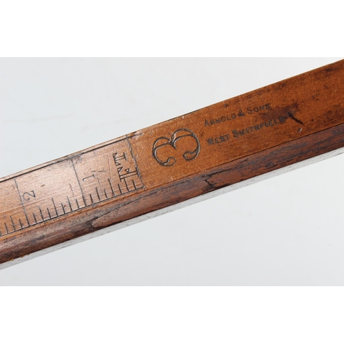 219 - An antique wood & brass surveyors measuring stick.