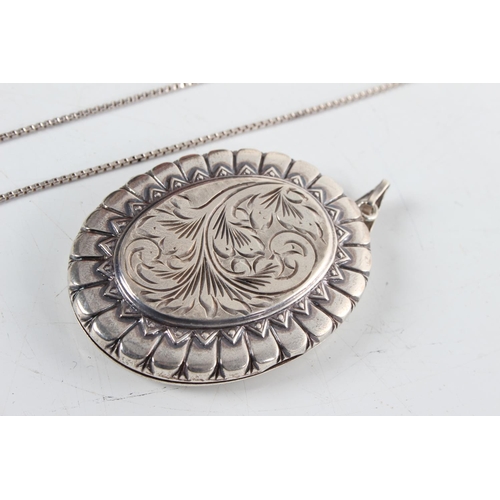 221 - A large sterling silver locket & chain.