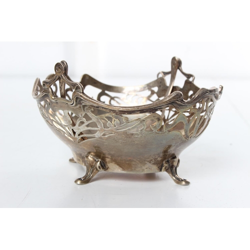 222 - A stunning antique sterling silver pierced basket with swing handle.