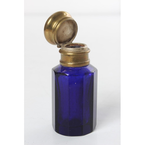 233 - A small antique cobalt blue glass bottle & decorative lipstick holder.