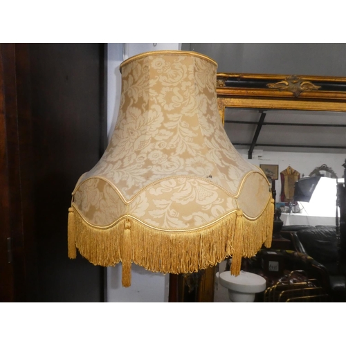 330 - A vintage standard lamp with shade.