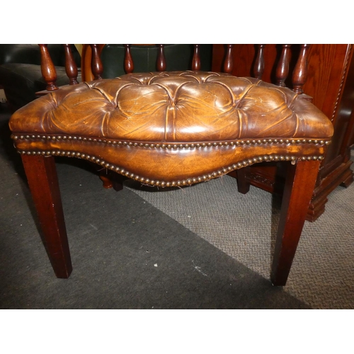 332 - A vintage button bow back chair with buttoned leather upholstery, in need of some restoration.