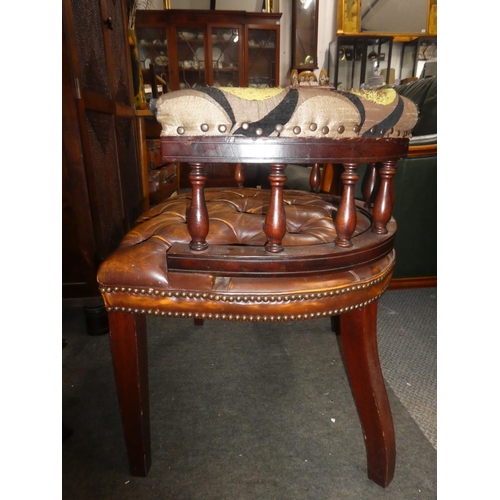 332 - A vintage button bow back chair with buttoned leather upholstery, in need of some restoration.