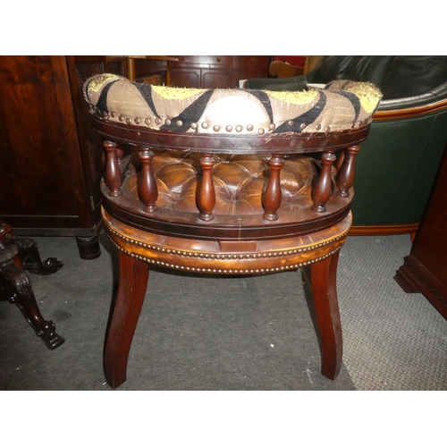 332 - A vintage button bow back chair with buttoned leather upholstery, in need of some restoration.