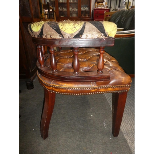 332 - A vintage button bow back chair with buttoned leather upholstery, in need of some restoration.