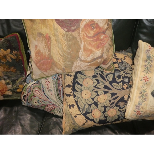 334 - A large assortment of various cushions.