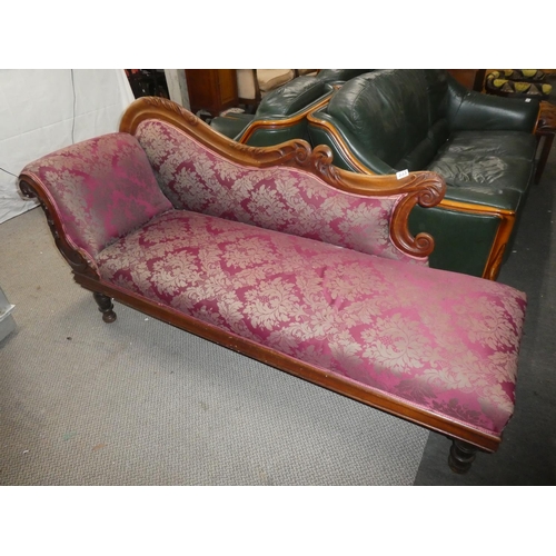 336 - An antique/ Edwardian chaise lounge with carved frame & decorative upholstery.