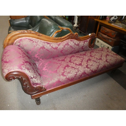 336 - An antique/ Edwardian chaise lounge with carved frame & decorative upholstery.