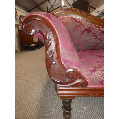 336 - An antique/ Edwardian chaise lounge with carved frame & decorative upholstery.