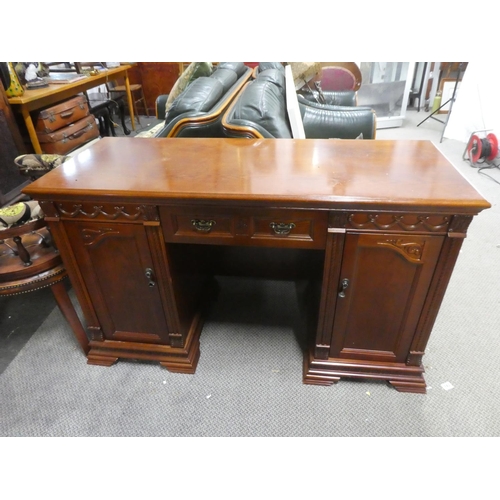 338 - A large modern office desk with carved panels. Measuring approx 52x21x31inches.