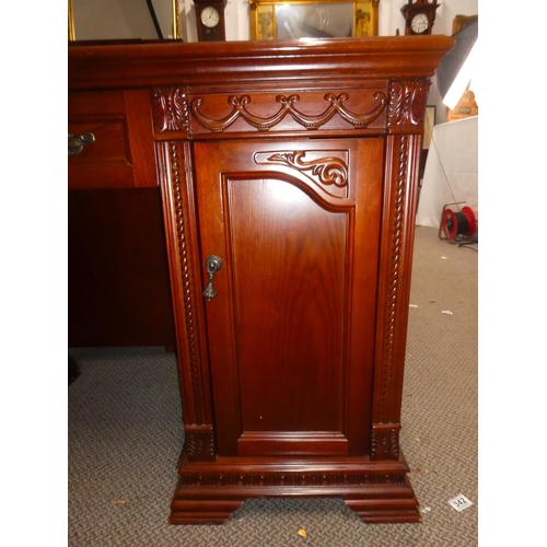 338 - A large modern office desk with carved panels. Measuring approx 52x21x31inches.