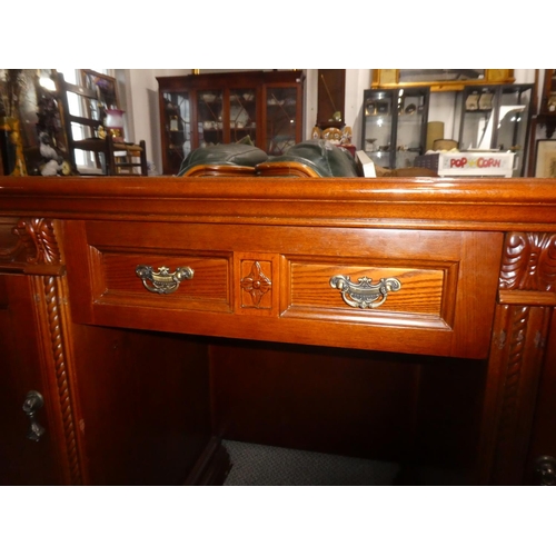 338 - A large modern office desk with carved panels. Measuring approx 52x21x31inches.