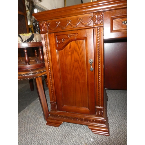 338 - A large modern office desk with carved panels. Measuring approx 52x21x31inches.