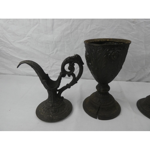 339 - A pair of decorative lead jugs, 1 in need of restoration, each measuring