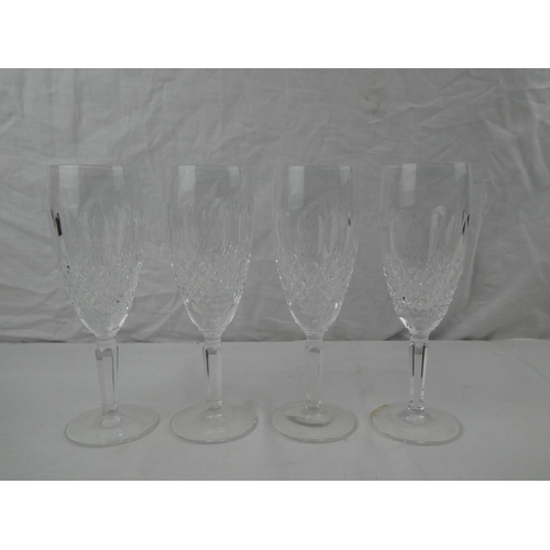 340 - A set of 4 Waterford Crystal champagne flutes.