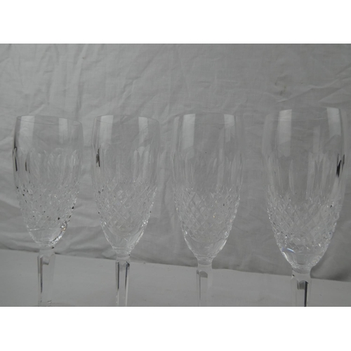 340 - A set of 4 Waterford Crystal champagne flutes.