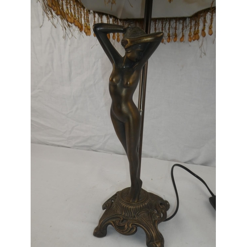 345 - A modern table lamp with nude figure.