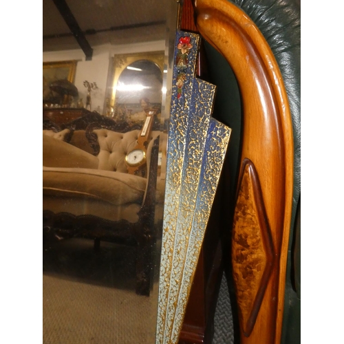 348 - An antique/ Art Deco style mirror with decorative floral detail. Measuring approx 17.5x28inches.