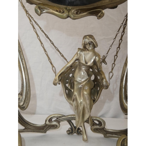 356 - A decorative antique/ Art Nouveau style dressing table mirror, with swinging figure.