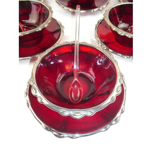 357 - A set of 6 red glass pudding bowls, plates & spoons.