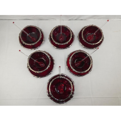 357 - A set of 6 red glass pudding bowls, plates & spoons.