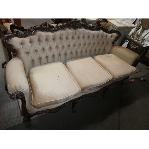 361 - A stunning antique style 3 seater sofa with button back upholstery & decoratively carved frame.