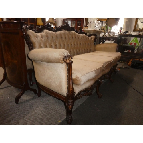 361 - A stunning antique style 3 seater sofa with button back upholstery & decoratively carved frame.