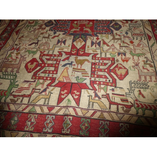 363 - A handwoven Iranian rug, decorated with various animals. Measuring 4ft x 5ft.