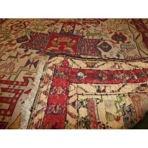 363 - A handwoven Iranian rug, decorated with various animals. Measuring 4ft x 5ft.