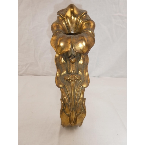 366 - A single decorative brass fire dog, with floral design.