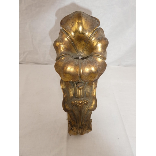 366 - A single decorative brass fire dog, with floral design.