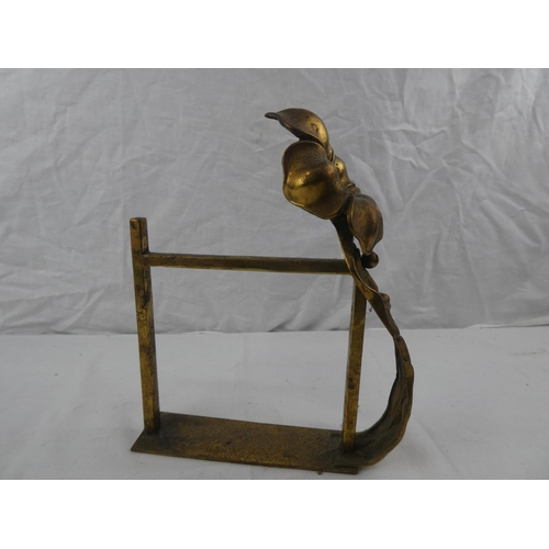 366 - A single decorative brass fire dog, with floral design.