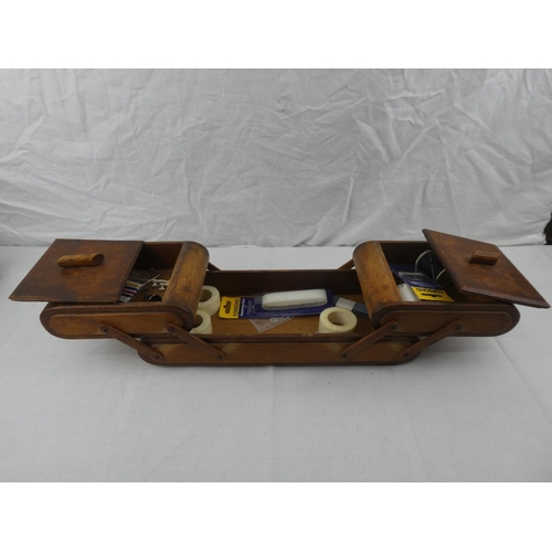 374 - A vintage wooden cantilever sewing box with contents.