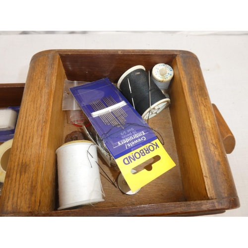 374 - A vintage wooden cantilever sewing box with contents.