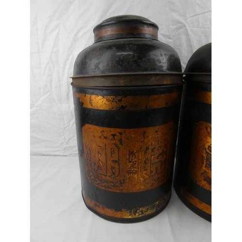 399 - A large pair of decorative shop counter tea caddies, each measuring 40cm tall.