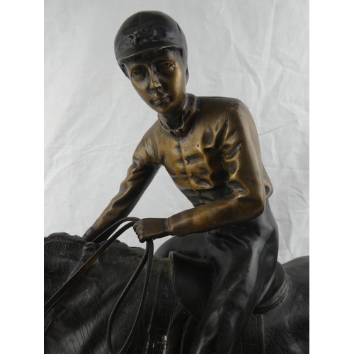 406 - A stunning large hollow cast bronze figure of a jockey on horse, no visible signature, measuring 24x... 