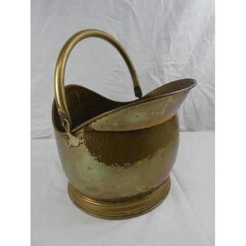 415 - A brass helmet coal scuttle.