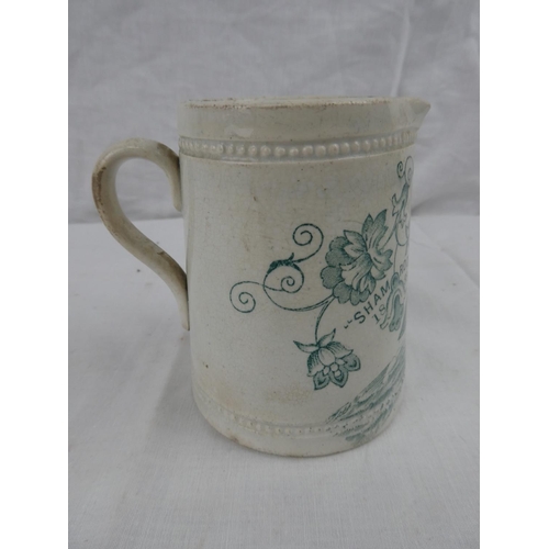 422 - A decorative antique milk jug, 'Shamrock 1888'. 4inches tall.