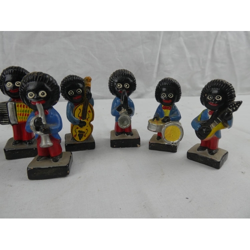 424 - A collection of 9 vintage hand painted Robinsons marmalade advertising figures.