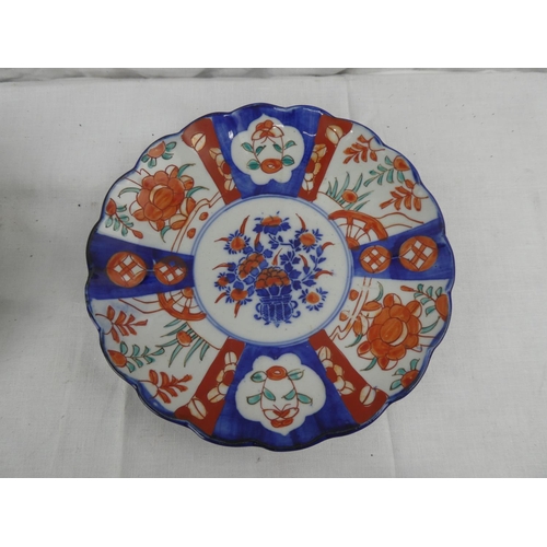 429 - A set of 3 antique hand painted Imari plates, along with similar piece.