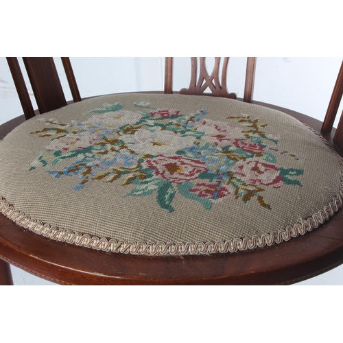 463 - An antique/ Edwardian bow back occasional chair with decorative needlepoint seat.