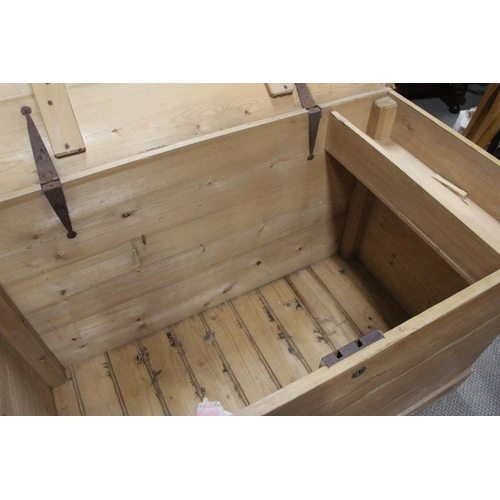 464 - A large antique Irish pine storage trunk/ blanket box. Measuring approx 49x26x32.5inches.