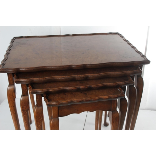 469 - A stunning antique nest of 4 walnut tables, with decorative edges, on cabriole legs.