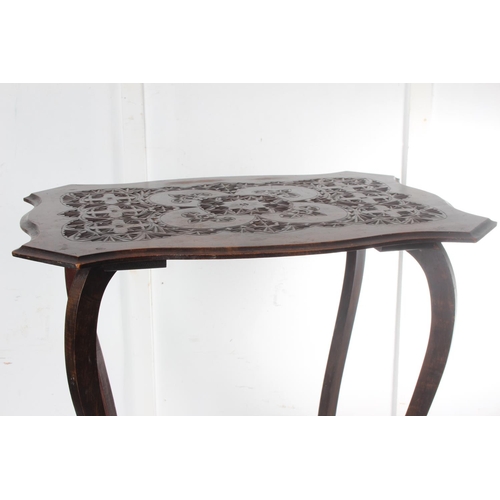 474 - An antique carved occasional table with decorative design. Measuring approx 24x19x28inches.