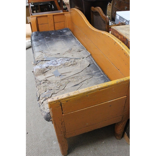 480 - A stunning Irish Vernacular primitive bench in original orange paint, with original seat pad, and th... 