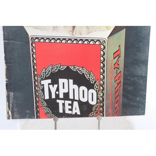 481 - A vintage Ty-Phoo Tea shop advertising card, 'The T that Stands for Taste', measuring 75x47cm.