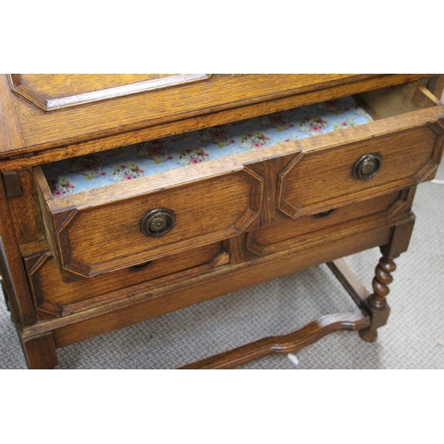 502 - An antique oak writing bureau. 29x15.5x40inches.