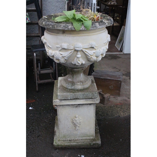 509 - A stunning pair of large antique style garden urns on pedestal bases, with decorative design. Each U... 