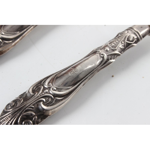 256 - A set of 6 antique sterling silver handled spoons.