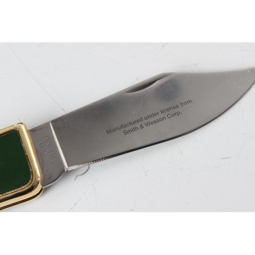 259 - A Franklin Mint novelty pocket knife, 'Smith & Wesson - .44 Caliber'.